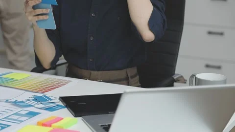 UX/UI designer working on wireframes for a website and mobile app prototype.. Stock Footage 309837463