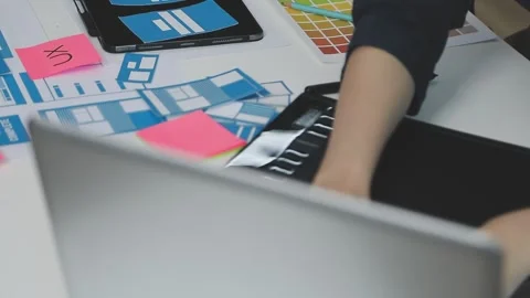 UX/UI designer working on wireframes for a website and mobile app prototype.. Stock Footage 309837526