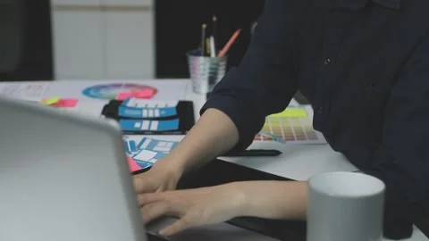 UX/UI designer working on wireframes for a website and mobile app prototype.. Stock Footage 309837529