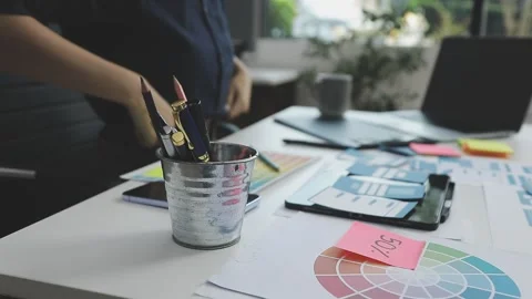 UX/UI designer working on wireframes for a website and mobile app prototype.. Stock Footage 309837552