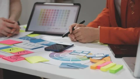 UX/UI designer working on wireframes for a website and mobile app prototype.. Stock Footage 309837685