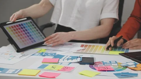 UX/UI designer working on wireframes for a website and mobile app prototype.. Stock Footage 309837686