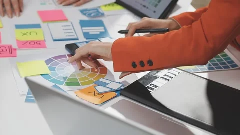 UX/UI designer working on wireframes for a website and mobile app prototype.. Stock Footage 309837691