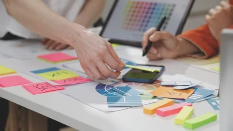 UX/UI designer working on wireframes for a website and mobile app prototype.. Stock Footage 309837695
