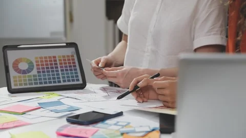 UX/UI designer working on wireframes for a website and mobile app prototype.. Stock Footage 309837707