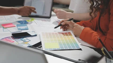 UX/UI designer working on wireframes for a website and mobile app prototype.. Stock Footage 309837724
