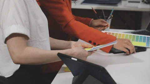 UX/UI designer working on wireframes for a website and mobile app prototype.. Stock Footage 309837745