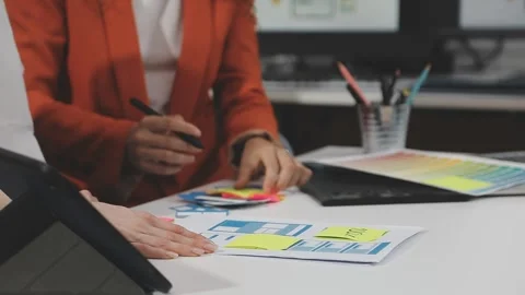 UX/UI designer working on wireframes for a website and mobile app prototype.. Stock Footage 309837747