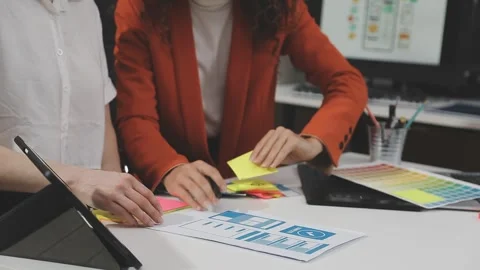 UX/UI designer working on wireframes for a website and mobile app prototype.. Stock Footage 309837748