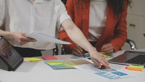UX/UI designer working on wireframes for a website and mobile app prototype.. Stock Footage 309837750