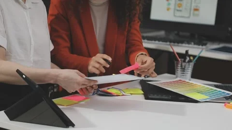 UX/UI designer working on wireframes for a website and mobile app prototype.. Stock Footage 309837759