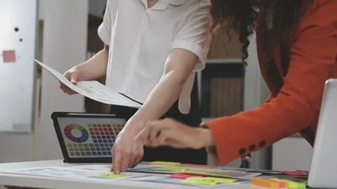 UX/UI designer working on wireframes for a website and mobile app prototype.. Stock Footage 309837772