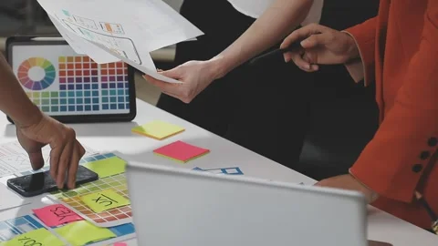UX/UI designer working on wireframes for a website and mobile app prototype.. Stock Footage 309837773