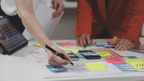 UX/UI designer working on wireframes for a website and mobile app prototype.. Stock Footage 309837798