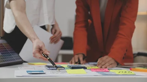 UX/UI designer working on wireframes for a website and mobile app prototype.. Stock Footage 309837811