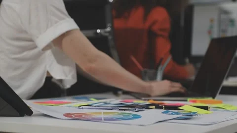UX/UI designer working on wireframes for a website and mobile app prototype.. Stock Footage 309837818