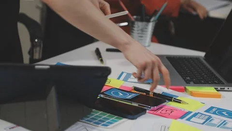 UX/UI designer working on wireframes for a website and mobile app prototype.. Stock Footage 309837836