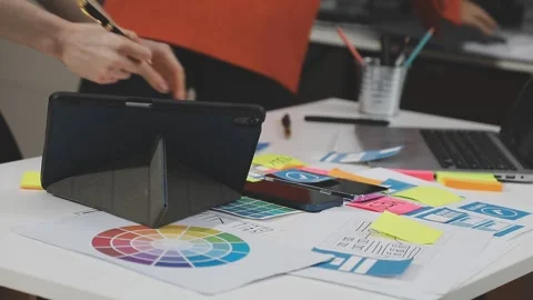 UX/UI designer working on wireframes for a website and mobile app prototype.. Stock Footage 309837845