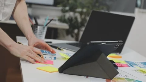 UX/UI designer working on wireframes for a website and mobile app prototype.. Stock Footage 309837857