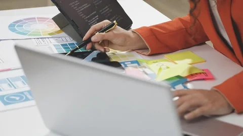 UX/UI designer working on wireframes for a website and mobile app prototype.. Stock Footage 309837928