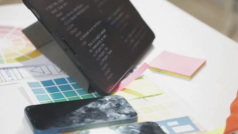 UX/UI designer working on wireframes for a website and mobile app prototype.. Stock Footage 309838172