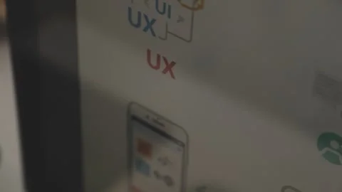 UX/UI designer working on wireframes for a website and mobile app prototype.. Stock Footage 309838288