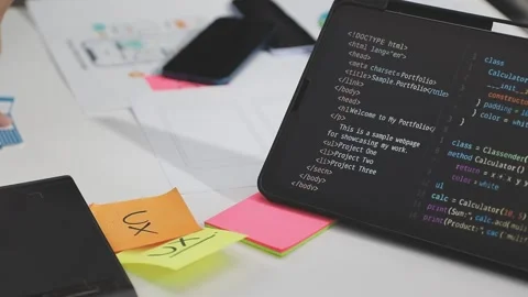 UX/UI designer working on wireframes for a website and mobile app prototype.. Stock Footage 309838289