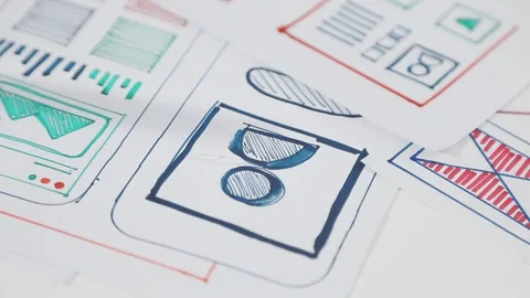 UX/UI designer working on wireframes for a website and mobile app prototype.. Stock Footage 309838298