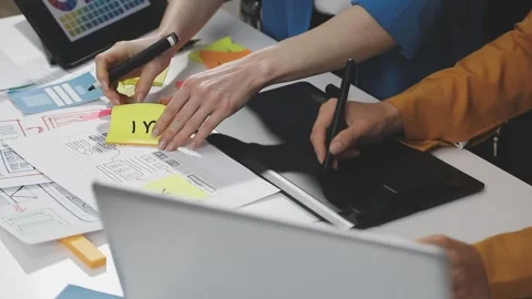 UX/UI designer working on wireframes for a website and mobile app prototype.. Stock Footage 309838336