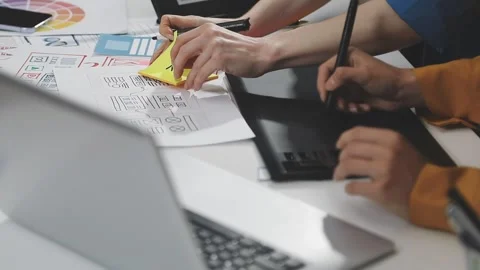UX/UI designer working on wireframes for a website and mobile app prototype.. Stock Footage 309838345