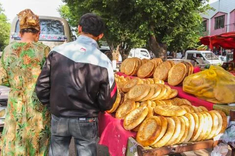 Uyghur flat bread sold at an open air market stall Stock Photos