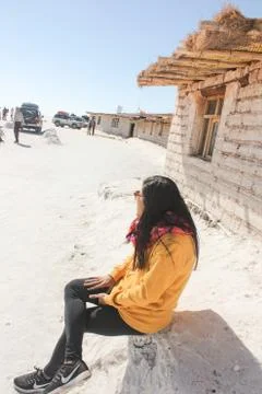 UYUNI, BOLIVIA - May 05, 2019: Beautiful Young Woman In Uyuni  Desert Stock Photos
