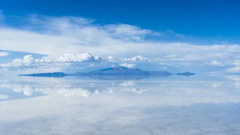 Uyuni Salt Flats and Reflection on Water. Tunupa Volcano. Bolivia Stock Footage 240749559
