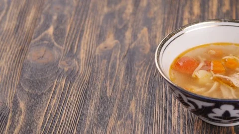 Uzbek lamian on a wooden table Stock Footage