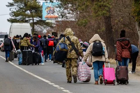 Uzhhorod, Ukraine - February 26, 2022: Ukrainian refugees with things rush to th Stock Photos