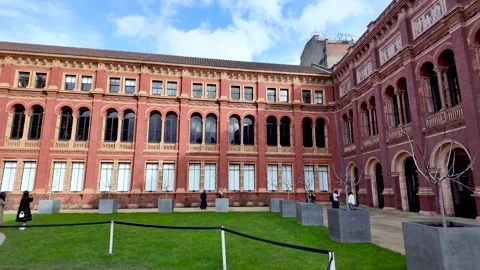 V and A courtyard featuring historic red brick architecture and green lawn with 動画素材 331212666