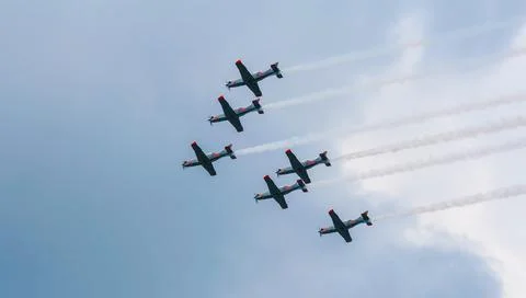 V formation against sky Stock Photos