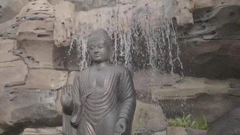 (V-LOG) Super Slow Motion Buddha Statue in Front of A Waterfall Water Fall Stock Footage 255919850