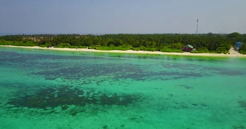 V05055 Aerial flying drone view of Maldives white sandy beach on sunny tropical Stock Footage