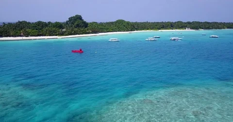 V05593 Aerial flying drone view of Maldives white sandy beach on sunny tropical Stock Footage