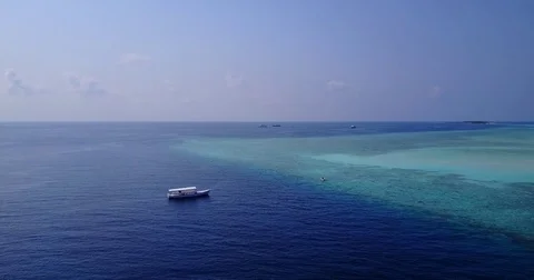 V05978 Aerial flying drone view of Maldives white sandy beach on sunny tropical Stock Footage