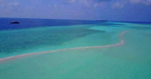 V06105 Aerial flying drone view of Maldives white sandy beach on sunny tropical Stock Footage