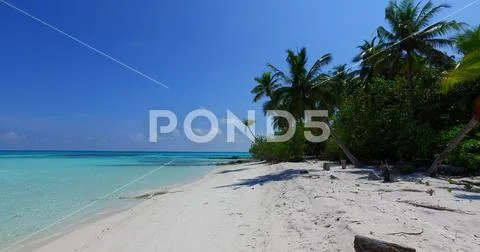 V07709 Maldives beautiful white sandy beach background on sunny tropical Stock Photos