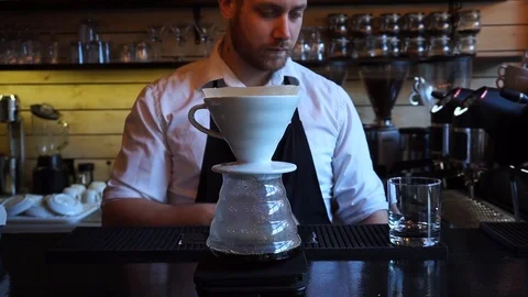 V60 coffee maker dripping barista waiting for second pour over Video stock 85616405