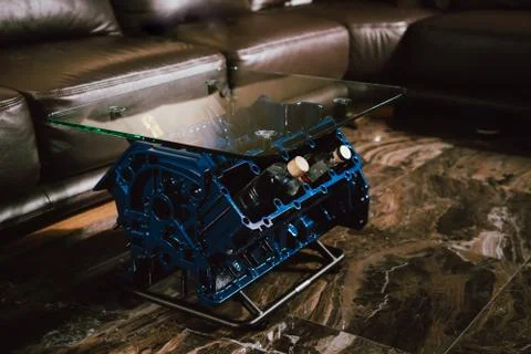 V8 Engine block table, painted in blue color. Loft stylish table furniture wi Stock Photos
