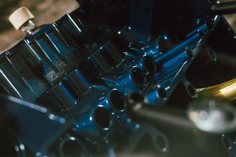 V8 Engine block table, painted in blue color. Loft stylish table furniture wi Stock Photos
