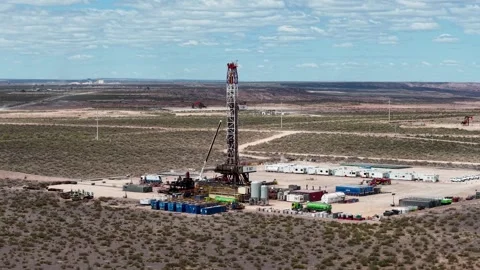 Vaca Muerta, Argentina, October 27, 2025: Aerial view of a drilling rig for.. Stock Footage 321552442