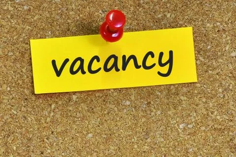 Vacancy  word on notes paper with cork background Foto stock