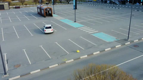 A vacant and empty parking showcasing a single car parked Stock Footage 303720675