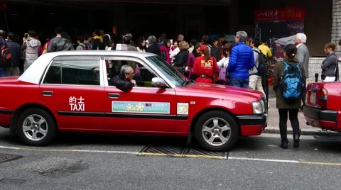 Vacant cab wait stand in vehicle queue, close view, red Hong Kong taxi Stock Footage 57479656